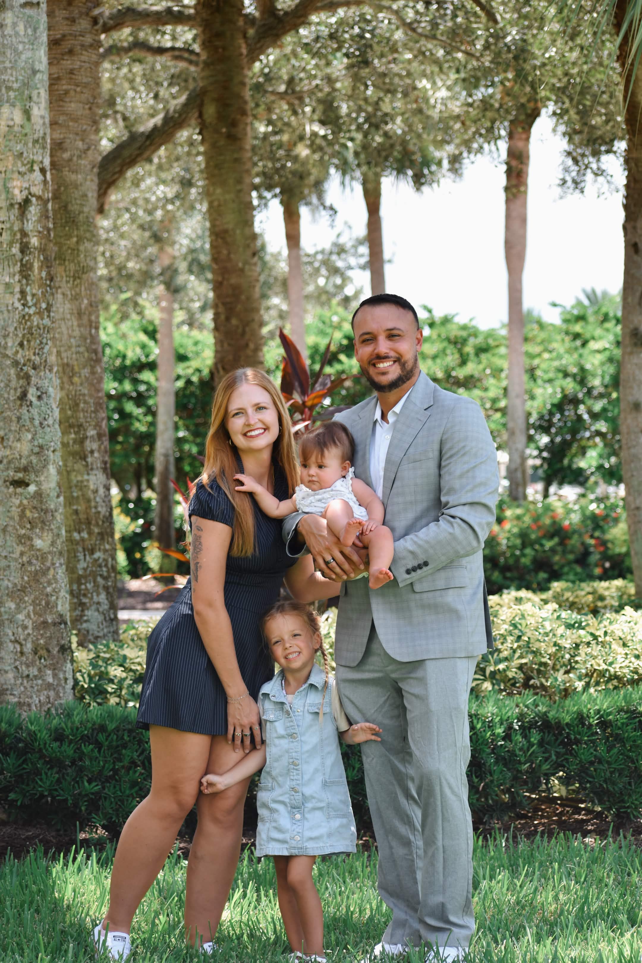 Danika with her husband and their two daughters in a Florida park